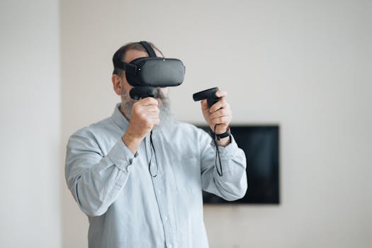 Senior man exploring virtual reality with VR headset and controllers indoors.