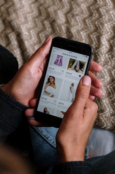 Close-up of a person shopping for clothing on a smartphone, highlighting the modern digital lifestyle.